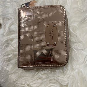 Zip around Micheal Kors wallet , rose gold